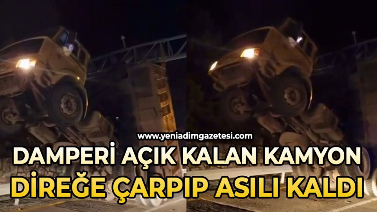 Damperi açık kamyon KGYS direğine çarparak asılı kaldı: 1 yaralı