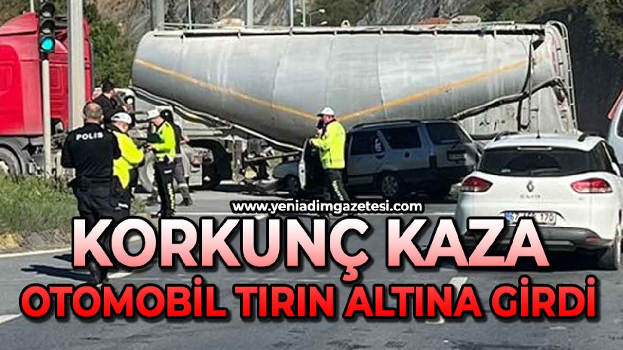 Otomobil tırın altına girdi