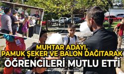 Muhtar adayı, pamuk şeker ve balon dağıtarak öğrencileri mutlu etti