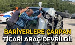 Bariyerlere çarpan ticari araç devrildi