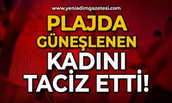 Plajda güneşlenen kadını taciz etti!