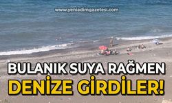 Bulanık suya rağmen denize girdiler!