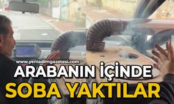 Otomobilin içinde soba yaktılar, odunla alevlendirdiler