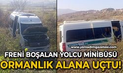 Freni boşalan minibüs ormana uçtu