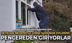 Heyelan nedeniyle girişi kapanan evlerine pencereden giriyor