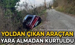 Yoldan çıkan araçtan yara almadan kurtuldu