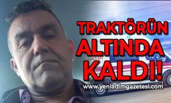 Devrilen traktörün altında kalan sürücü ağır yaralandı