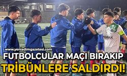 Futbolcular maçı bırakıp, tribüne saldırdı