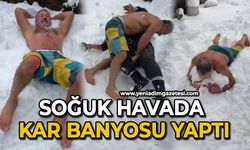 Soğuk havada kar banyosu yaptı