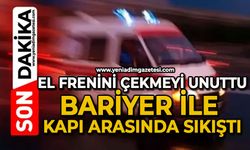 El frenini çekmeyi unuttu, bariyer ile kapı arasında sıkıştı