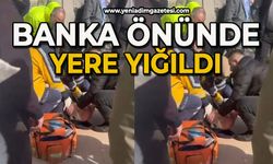 Banka önünde yere yığıldı