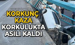 Korkulukları yıkan otomobil duvarda asılı kaldı, sürücü burnu bile kanamadan kurtuldu