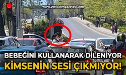 Bebeğini kullanarak dileniyor, kimsenin sesi çıkmıyor!