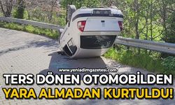 Ters dönen otomobilden yara almadan kurtuldu