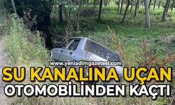 Su kanalına uçan otomobilinden kaçtı