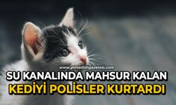 Su kanalında mahsur kalan kediyi polisler kurtardı