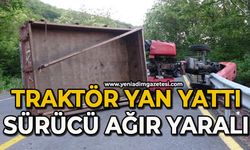 Yan yatan traktörün altında kalan sürücü ağır yaralandı