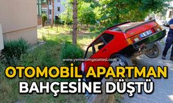 Otomobil apartman bahçesine düştü