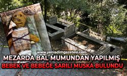 Mezarda bal mumundan yapılmış bebek ve bebeğe sarılı muska bulundu