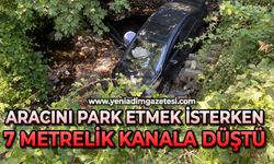 Aracını park etmek isterken 7 metrelik kanala düştü