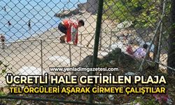 Ücretli hale getirilen plaja tel örgüleri aşarak girmeye çalıştılar