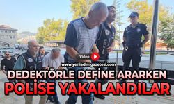 Dedektörle define ararken polise yakalandılar