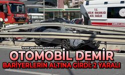 Hafriyat kamyonu ile çarpışan otomobil demir bariyerlerin altına girdi: 2 yaralı