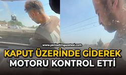 Kaput üzerinde giderek motoru kontrol etti