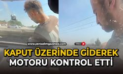 Kaput üzerinde giderek motoru kontrol etti