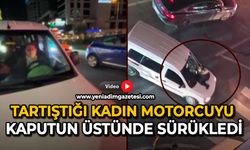 Tartıştığı kadın motorcuyu kaputun üstünde sürükledi