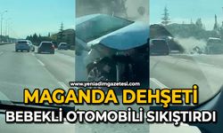 Maganda dehşeti: Bebekli otomobili sıkıştırdı