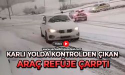 Karlı yolda kontrolden çıkan araç refüje çarptı