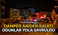 Damper aniden kalktı: Odunlar yola savruldu