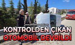 Kontrolden çıkan otomobil yan devrildi