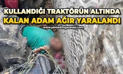 Kullandığı traktörün altında kalan çiftçi ağır yaralandı