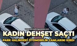 Kadın dehşet saçtı: Park halindeki otomobilin camlarını kırdı