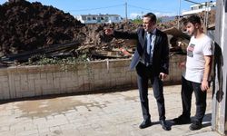 Başkan Özlü'den selzede esnafa destek