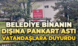 Belediye binanın dışına pankart astı: Vatandaşlara duyurdu