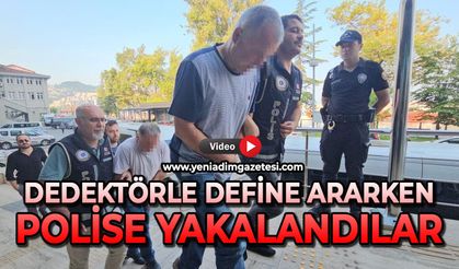 Dedektörle define ararken polise yakalandılar