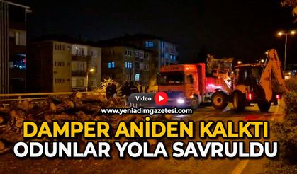 Damper aniden kalktı: Odunlar yola savruldu
