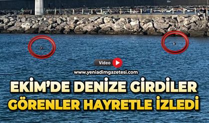 Ekim’de denize girdiler: Görenler hayretle izledi