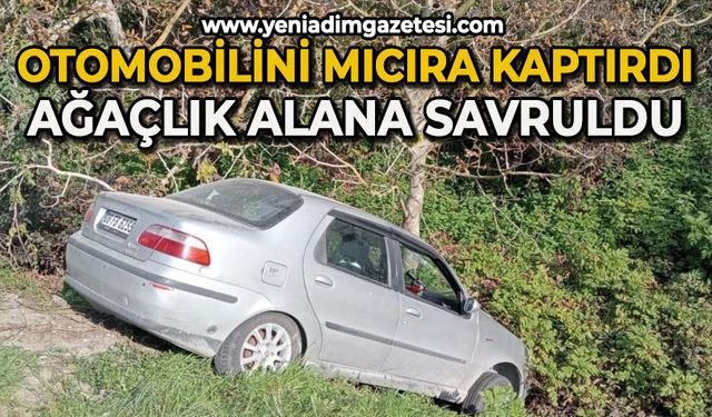 Otomobilini mıcıra kaptırdı, ağaçlık alana savruldu