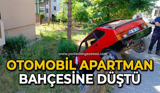Otomobil apartman bahçesine düştü