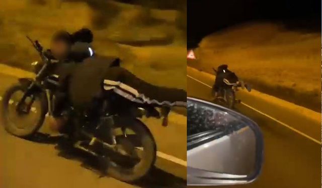Yüzüstü yatarak motosiklet kullandı