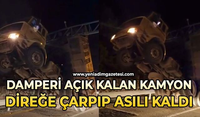 Damperi açık kamyon KGYS direğine çarparak asılı kaldı: 1 yaralı