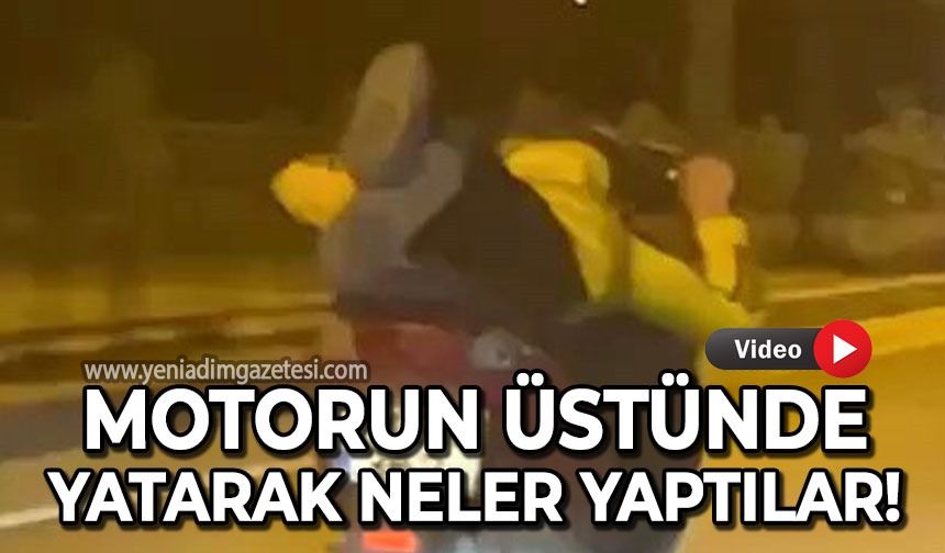 Motorun üstünde yatarak canlarını hiçe saydılar: İşte o görüntüler!