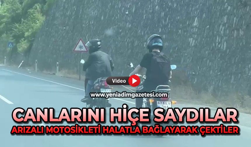 Canlarını hiçe saydılar: Arızalı motosikleti halatla bağlayarak çektiler
