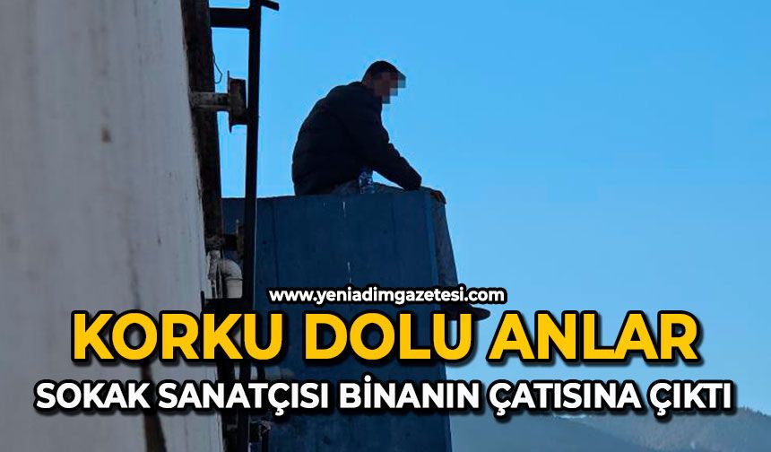 Korku dolu anlar: Sokak sanatçısı binanın çatısına çıktı