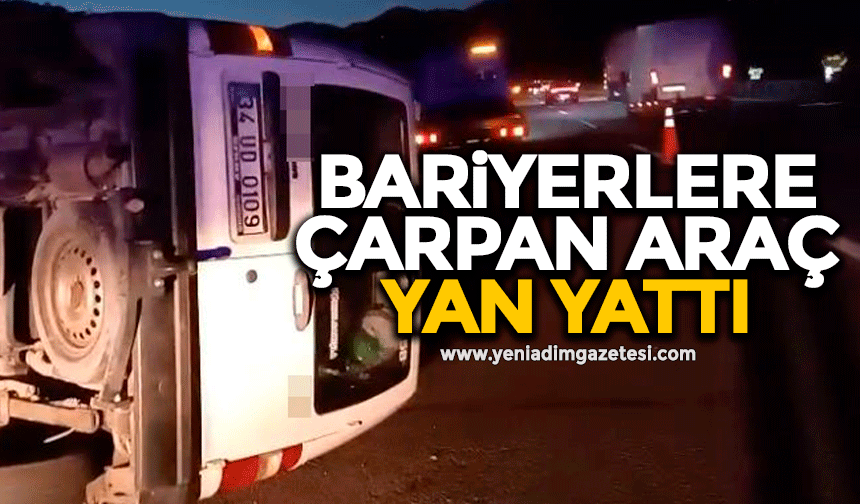 Bariyerlere çarpan araç yan yattı